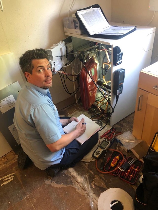 Engineer carrying out boiler service to Worcester Highflow